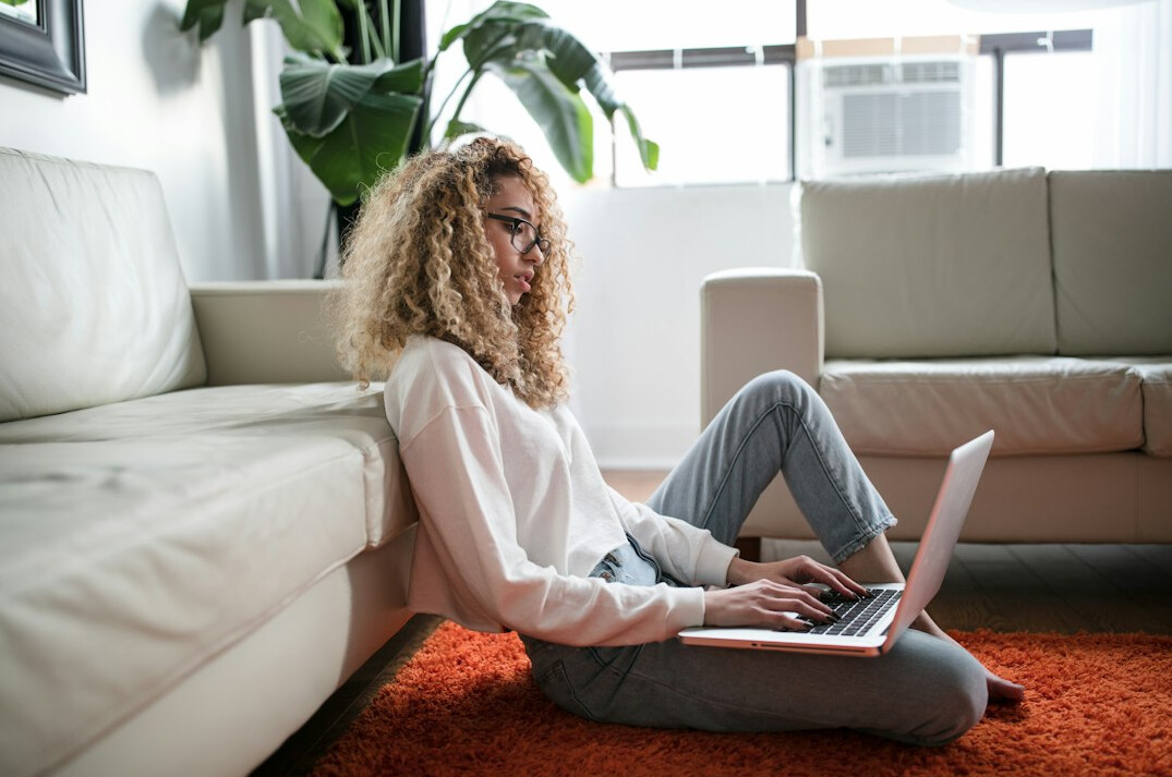 person working remotely on laptop